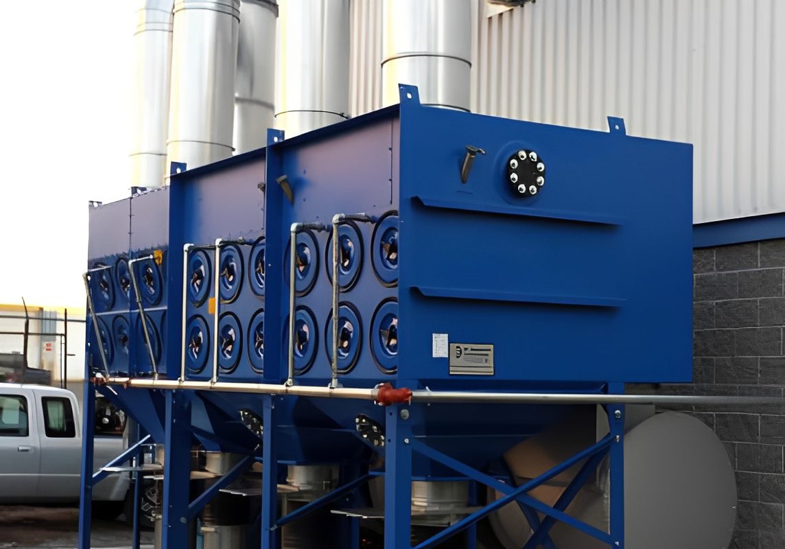 Industrial blue dust collector with pipes.